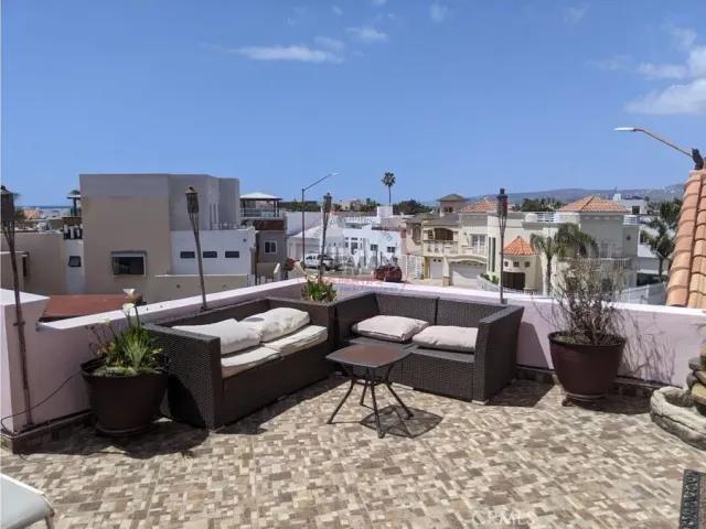 a view of a kitchen with kitchen island a counter top space cabinets and stainless steel appliances