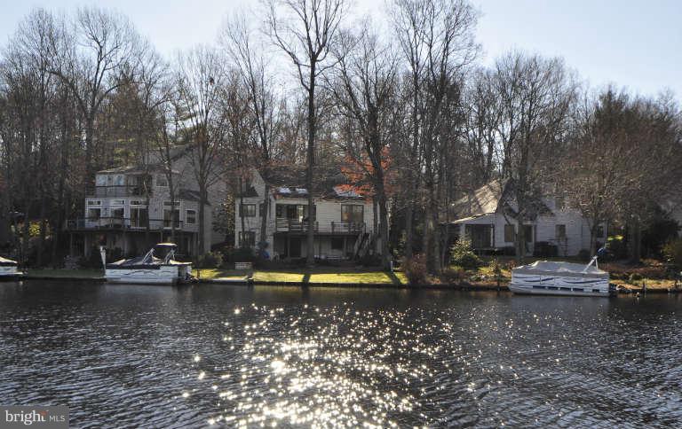 2260 Compass Point Lane Reston, VA 20191 - Photo 2 of 23 a view of a lake with houses