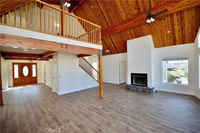 a view of an entryway with wooden floor