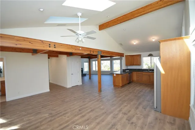 a kitchen with stainless steel appliances kitchen island a refrigerator and a stove