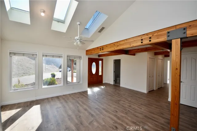 a view of an entryway with wooden floor