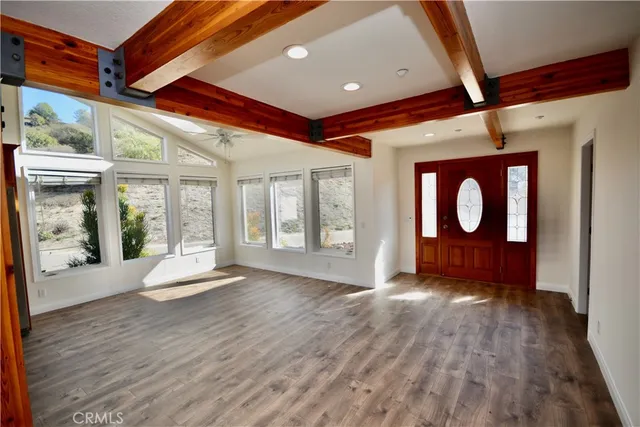 a view of an entryway with wooden floor
