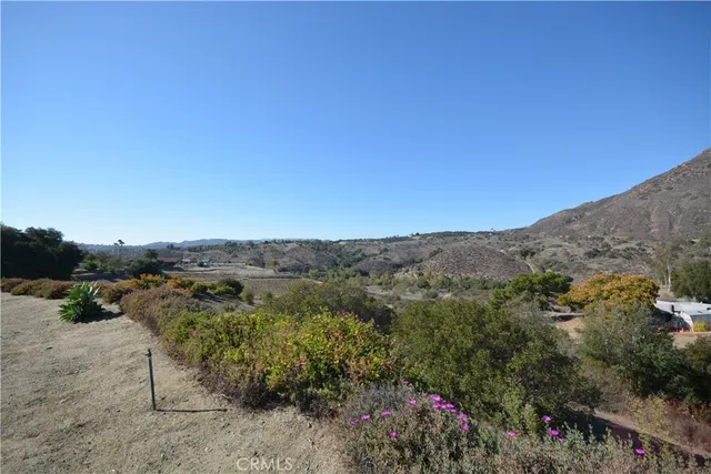 an aerial view of mountain with trees around