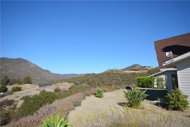a view of a house with a mountain
