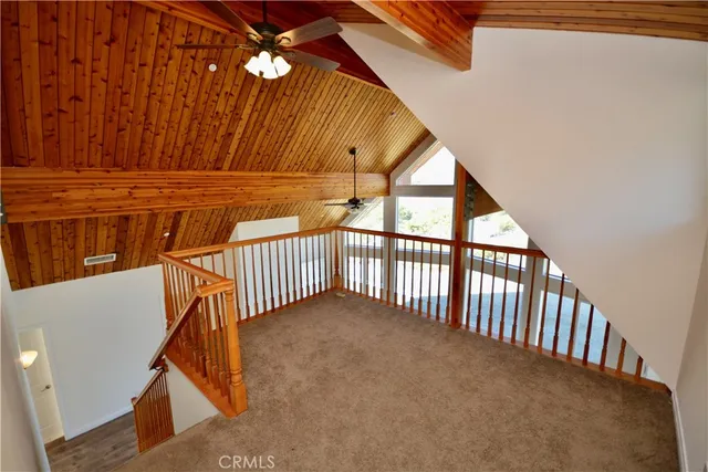 a view of a hallway with staircase