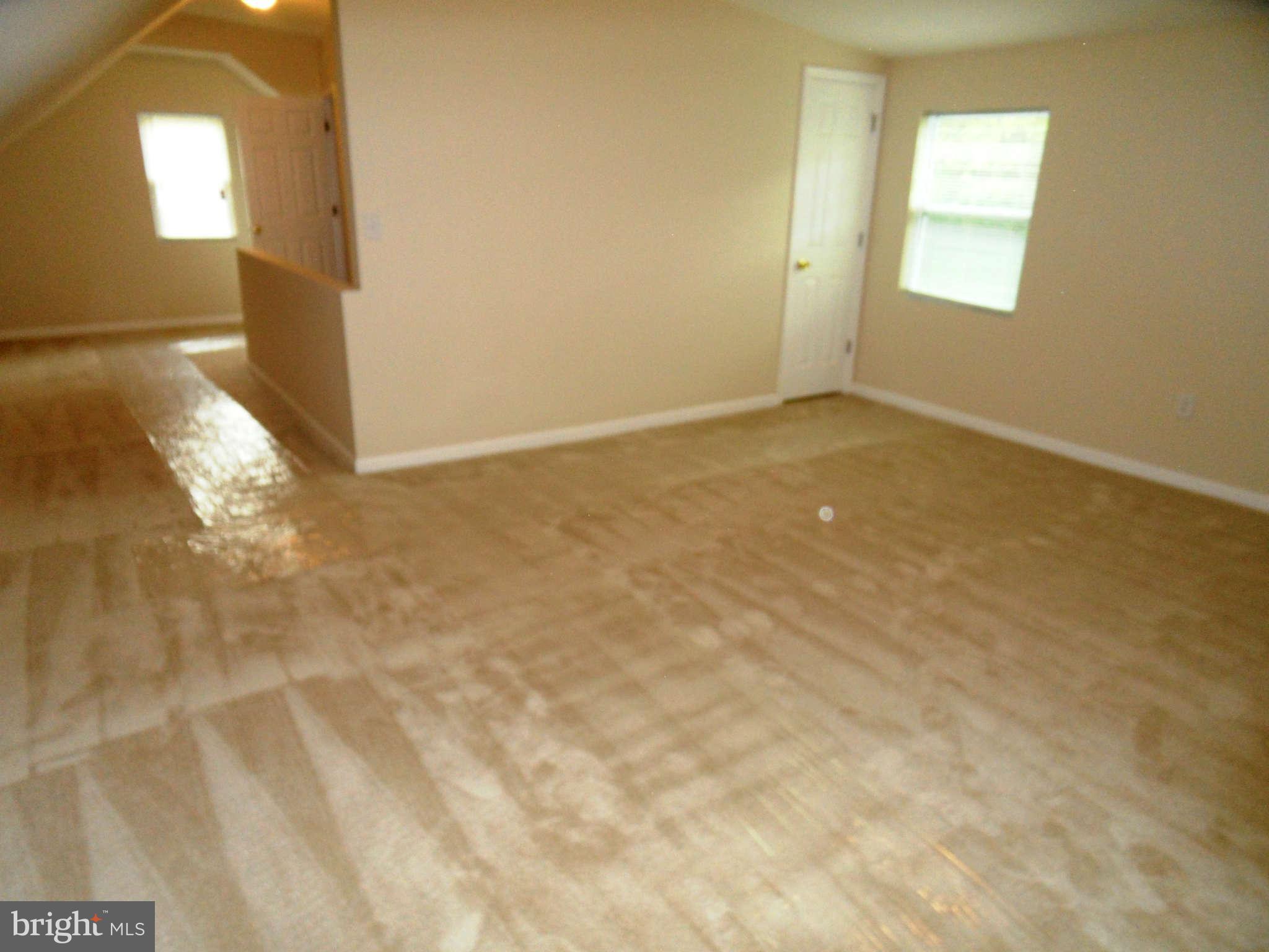 7019 Brompton Road Baltimore, MD 21207 - Photo 14 of 26 a view of an empty room and window