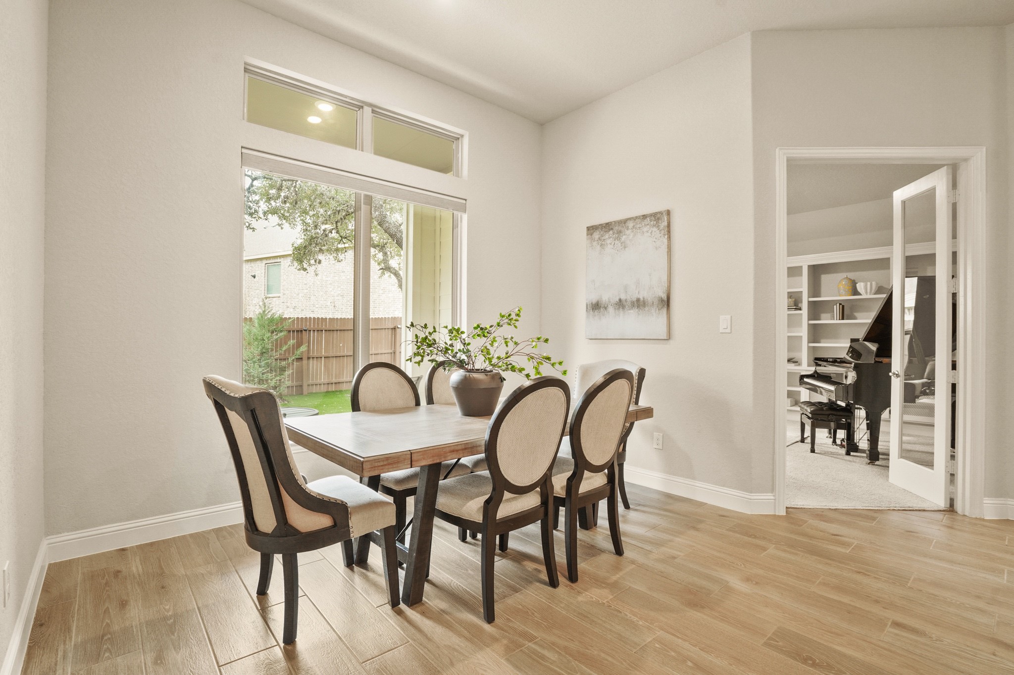 29411 Kearney Ridge Boerne, TX 78015 - Photo 18 of 34 a dining room with furniture and wooden floor