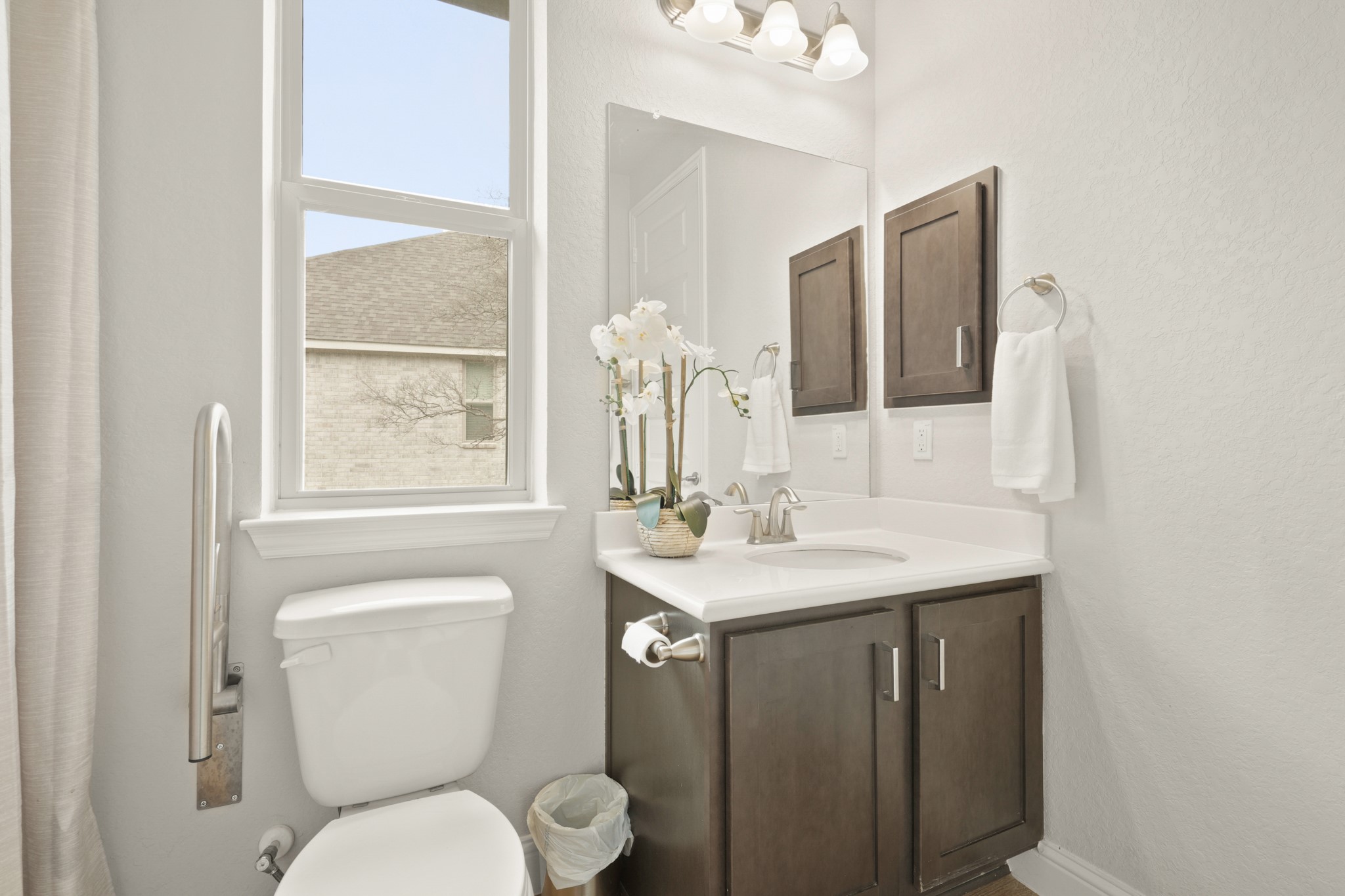 29411 Kearney Ridge Boerne, TX 78015 - Photo 22 of 34 a bathroom with a toilet a sink and mirror