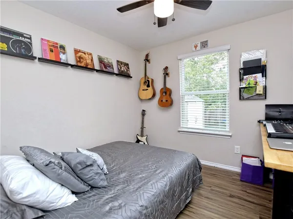 a bedroom with bed and a window