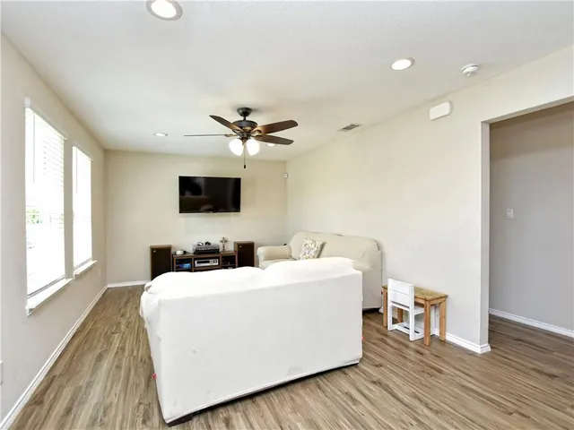 a living room with a couch and a flat screen tv