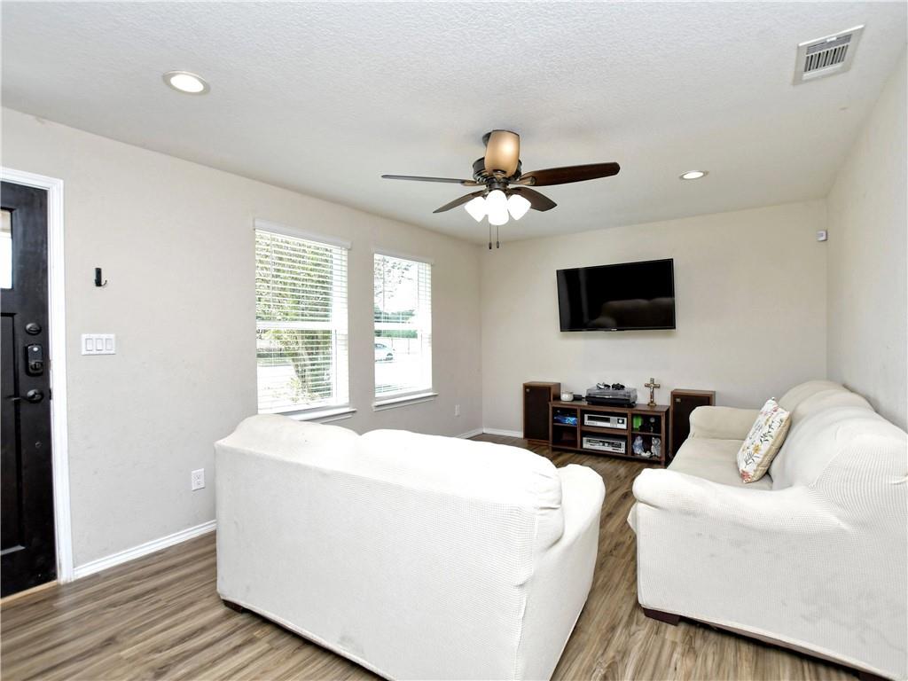 504 West 2nd Street Elgin, TX 78621 - Photo 14 of 22 a living room with furniture and a flat screen tv