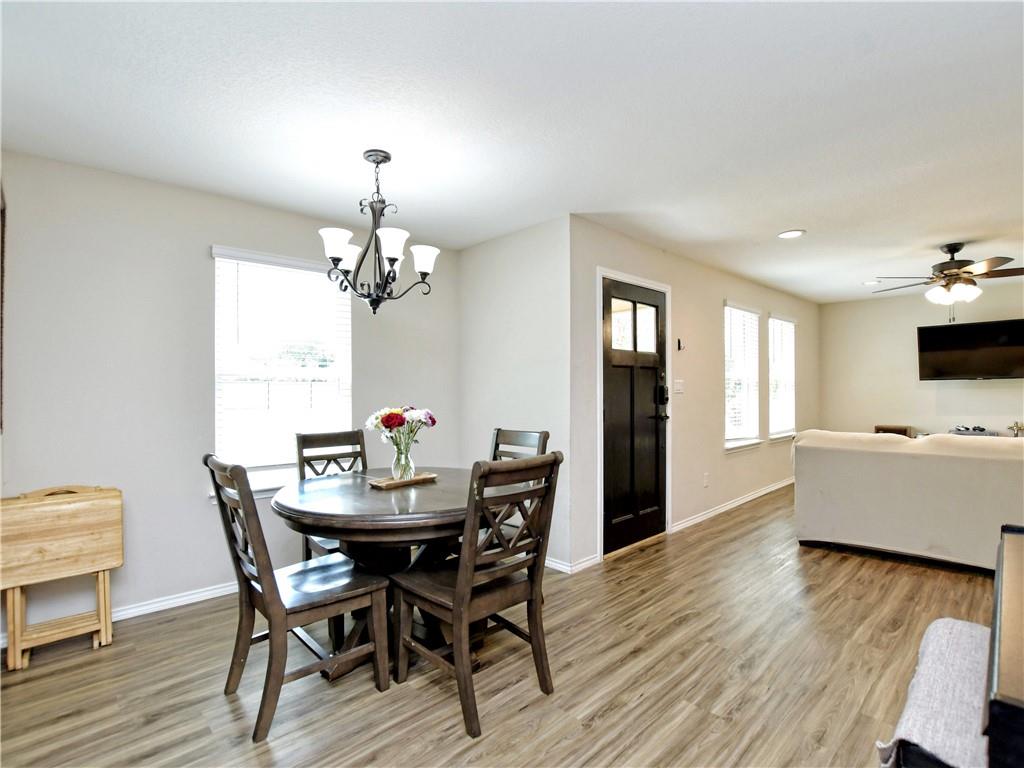 504 West 2nd Street Elgin, TX 78621 - Photo 16 of 22 a view of a dining room with furniture window and wooden floor