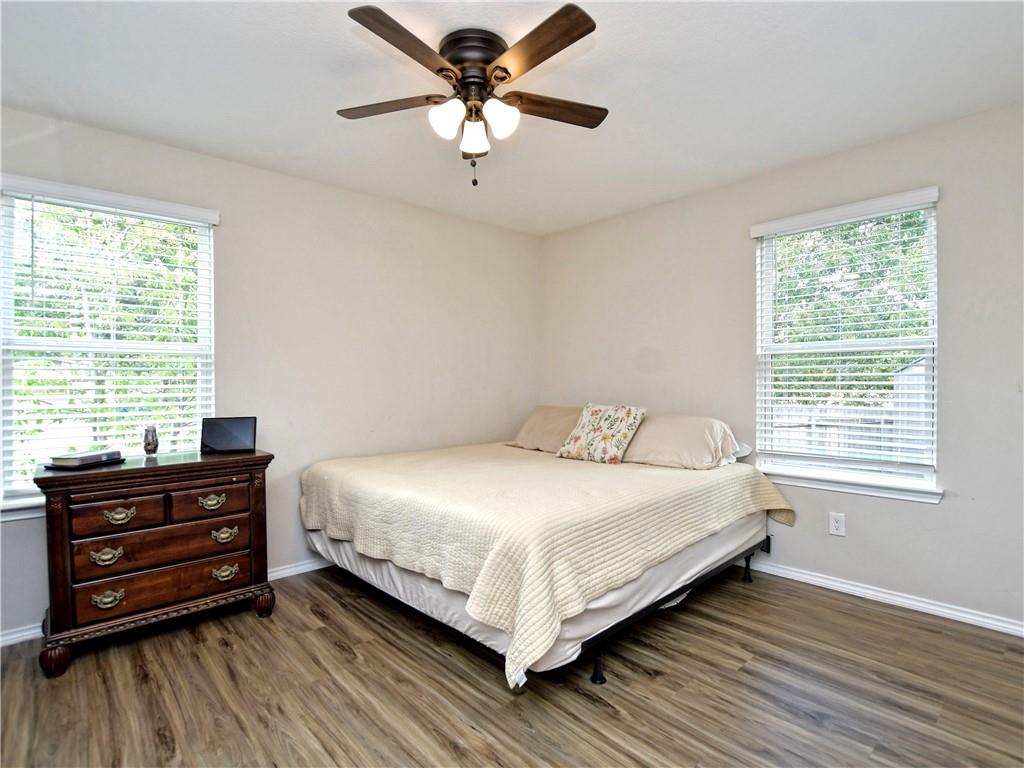504 West 2nd Street Elgin, TX 78621 - Photo 5 of 22 a bedroom with a bed dresser and a window