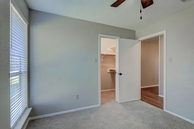 wooden floor and window in an empty room
