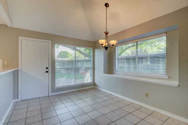 a view of an empty room with windows