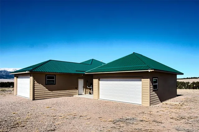 a house with trees in the background