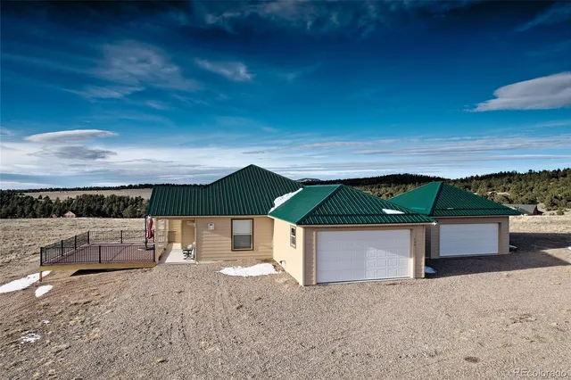a front view of a house with yard