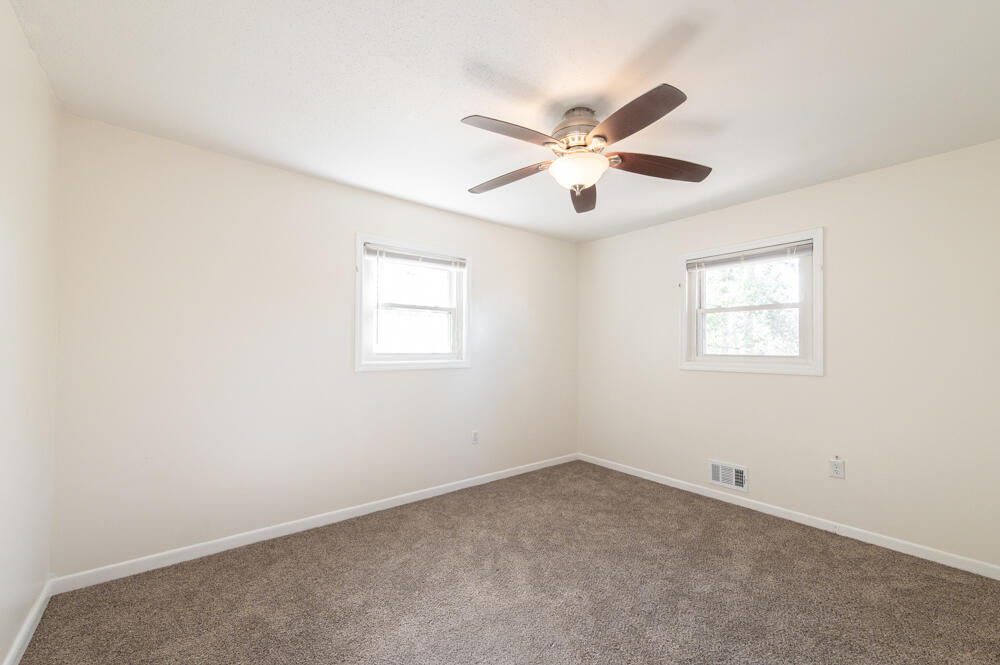 335 Indian Trail Augusta, GA 30907 - Photo 13 of 24 an empty room with windows and fan