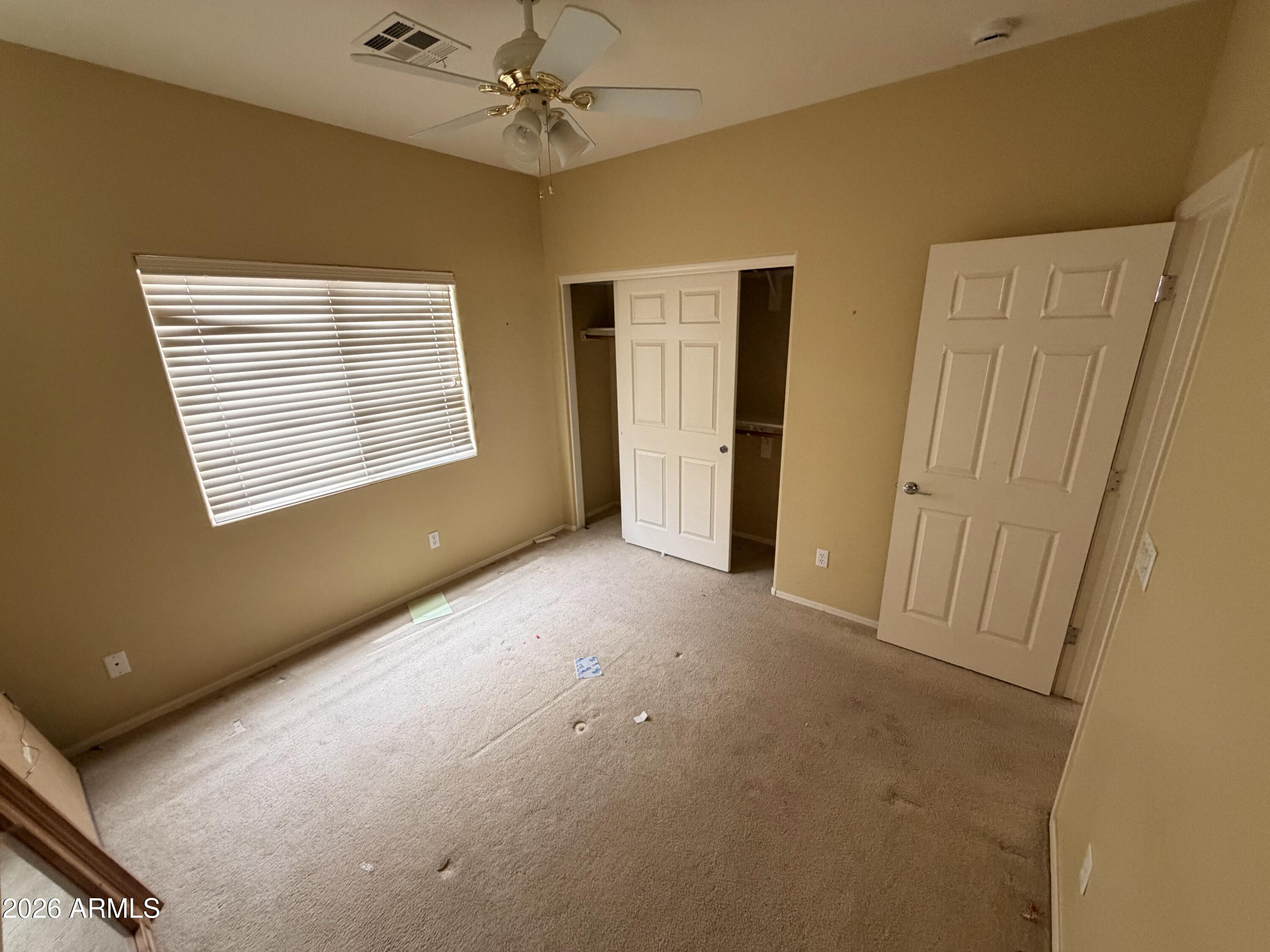 19466 East Reins Road Queen Creek, AZ 85142 - Photo 7 of 10 a view of an empty room with a window