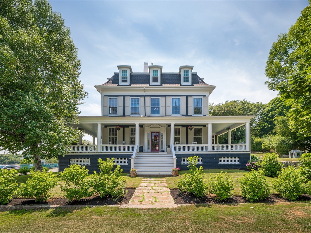 a front view of a house with a yard