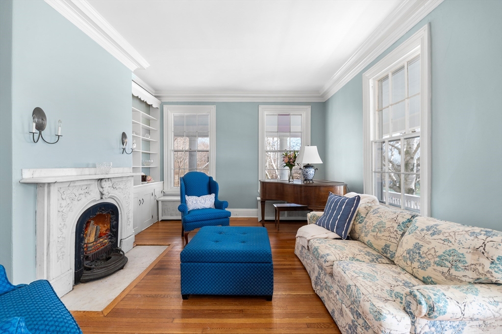 31 Beach Road Gloucester, MA 01930 - Photo 12 of 43 a living room with furniture a fireplace and a window