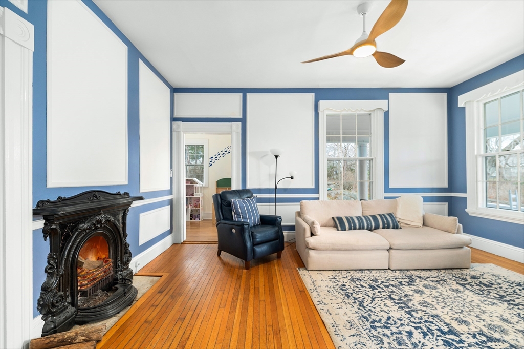 31 Beach Road Gloucester, MA 01930 - Photo 15 of 43 a living room with furniture and a fireplace