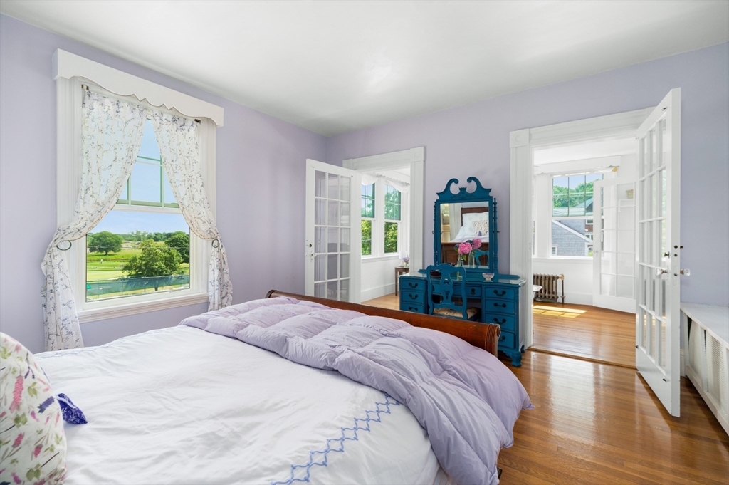 31 Beach Road Gloucester, MA 01930 - Photo 19 of 43 a bedroom with a large bed and a window