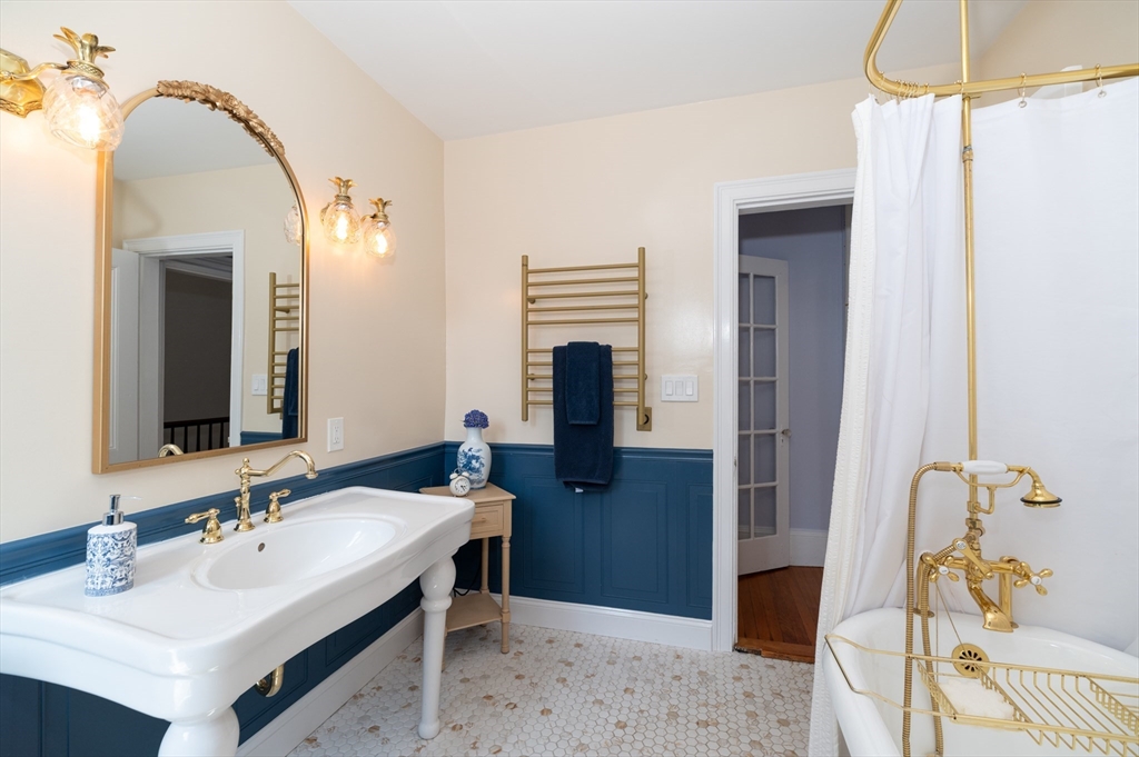 31 Beach Road Gloucester, MA 01930 - Photo 20 of 43 a bathroom with a sink and a mirror