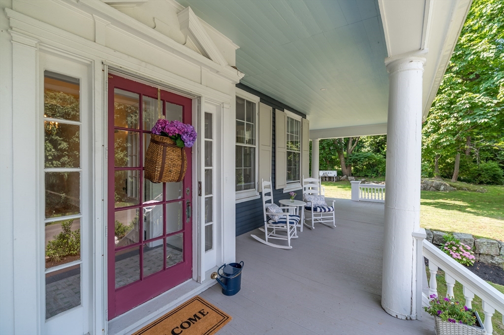 31 Beach Road Gloucester, MA 01930 - Photo 2 of 43 a view of a porch with chairs and backyard
