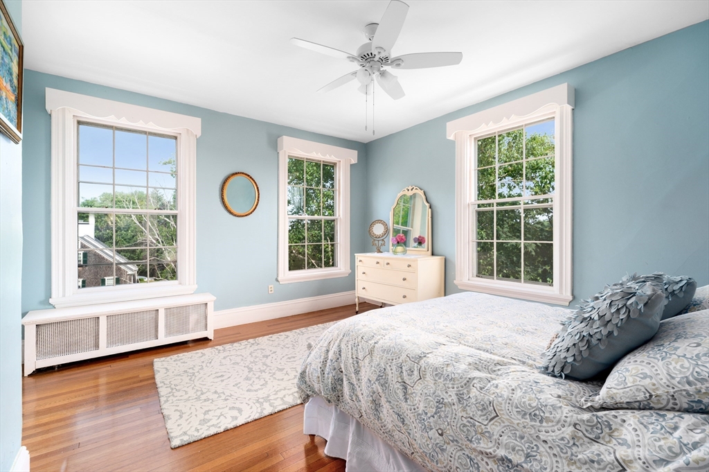 31 Beach Road Gloucester, MA 01930 - Photo 22 of 43 a large bed sitting in a bedroom next to a window