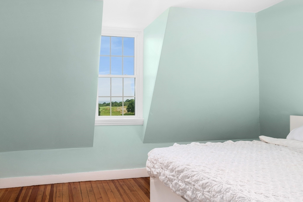 31 Beach Road Gloucester, MA 01930 - Photo 26 of 43 a bedroom with a bed and a window