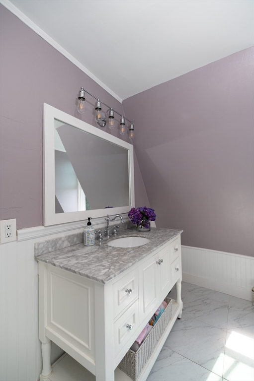31 Beach Road Gloucester, MA 01930 - Photo 27 of 43 a bathroom with a sink and a mirror