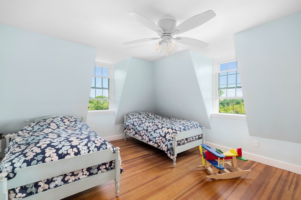 31 Beach Road Gloucester, MA 01930 - Photo 29 of 43 a bedroom with two beds and a window