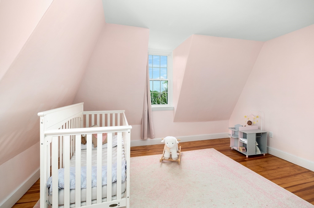 31 Beach Road Gloucester, MA 01930 - Photo 31 of 43 a bedroom with a bed and a window