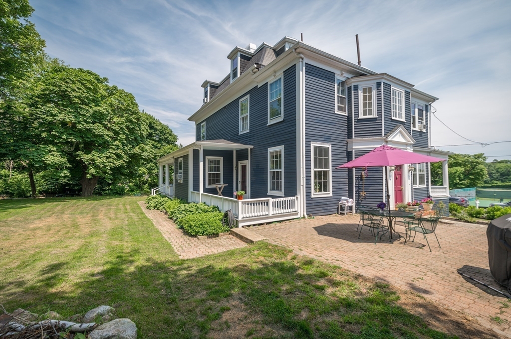 31 Beach Road Gloucester, MA 01930 - Photo 33 of 43 a front view of a house with porch and garden