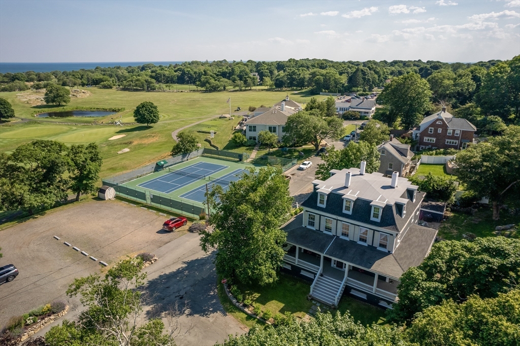 31 Beach Road Gloucester, MA 01930 - Photo 38 of 43 an aerial view of a house with a garden and lake view