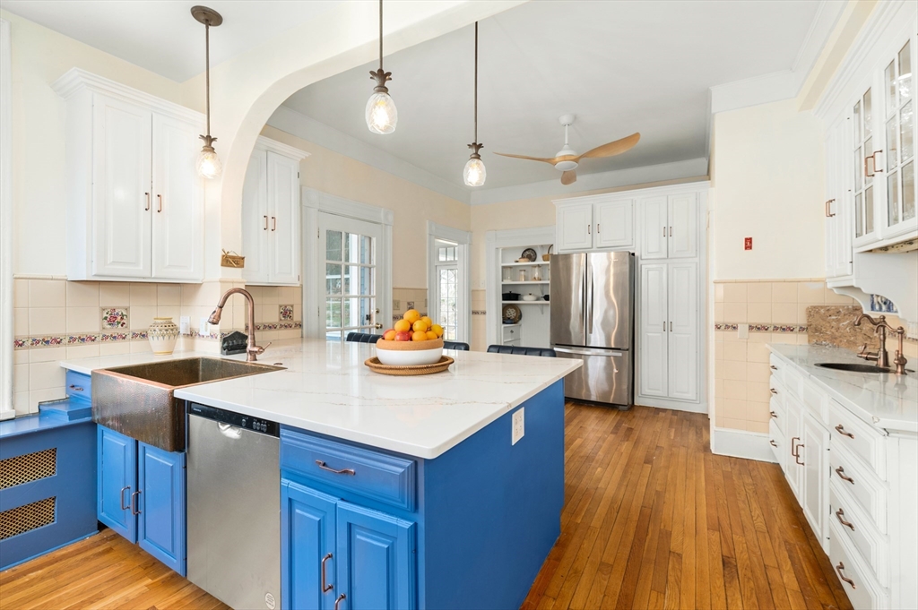 31 Beach Road Gloucester, MA 01930 - Photo 7 of 43 a kitchen with refrigerator and cabinets