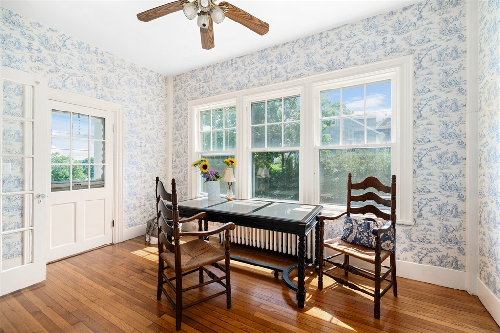 31 Beach Road Gloucester, MA 01930 - Photo 10 of 43 a dining room with furniture wooden floor a potted plant and a chandelier