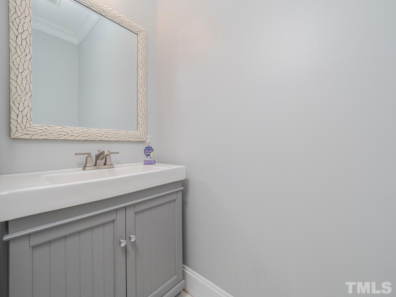 910 South Person Street Raleigh, NC 27601 - Photo 12 of 30 a bathroom with a sink and a mirror