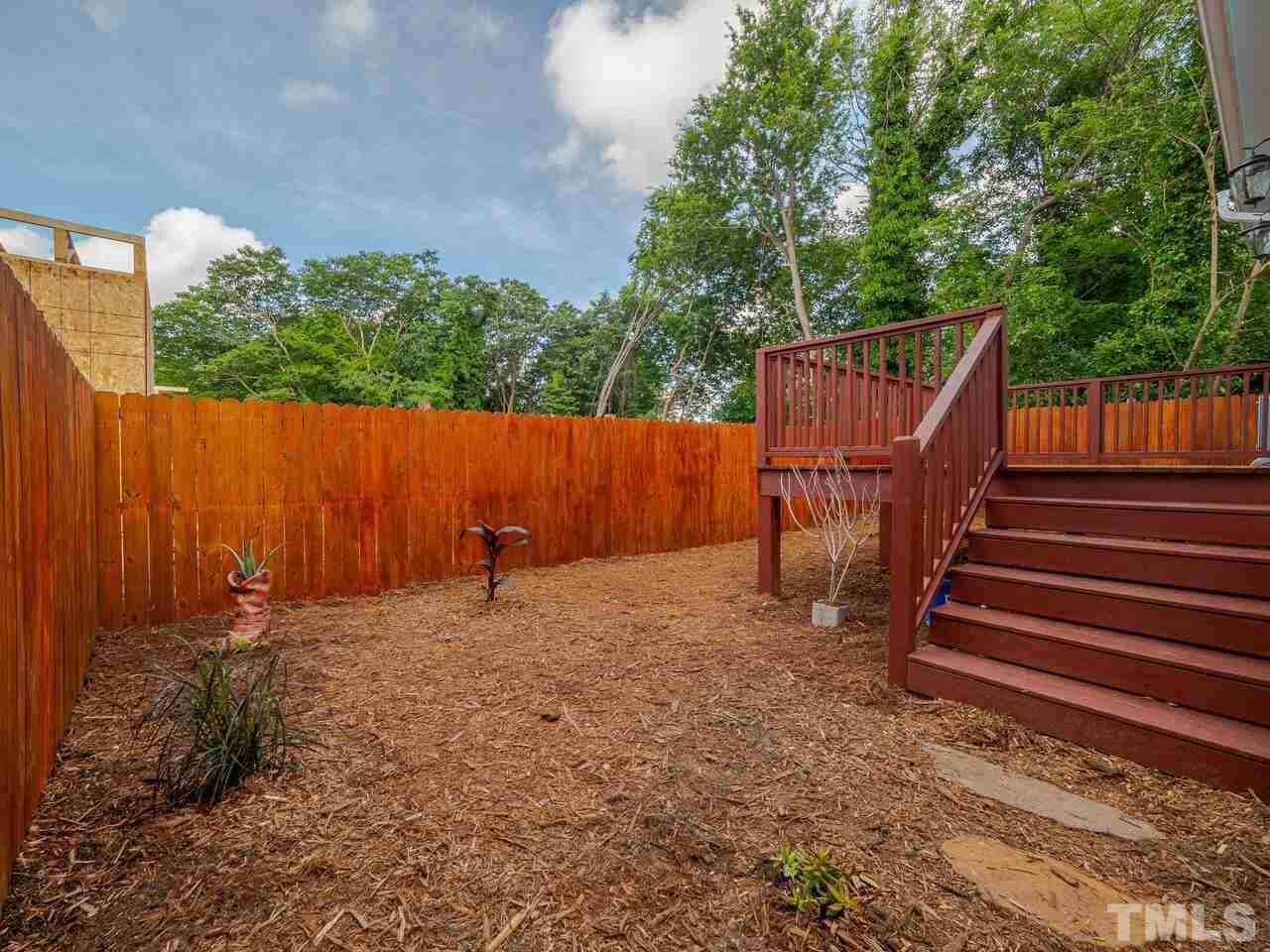 910 South Person Street Raleigh, NC 27601 - Photo 25 of 30 a backyard of a house with a table and chairs