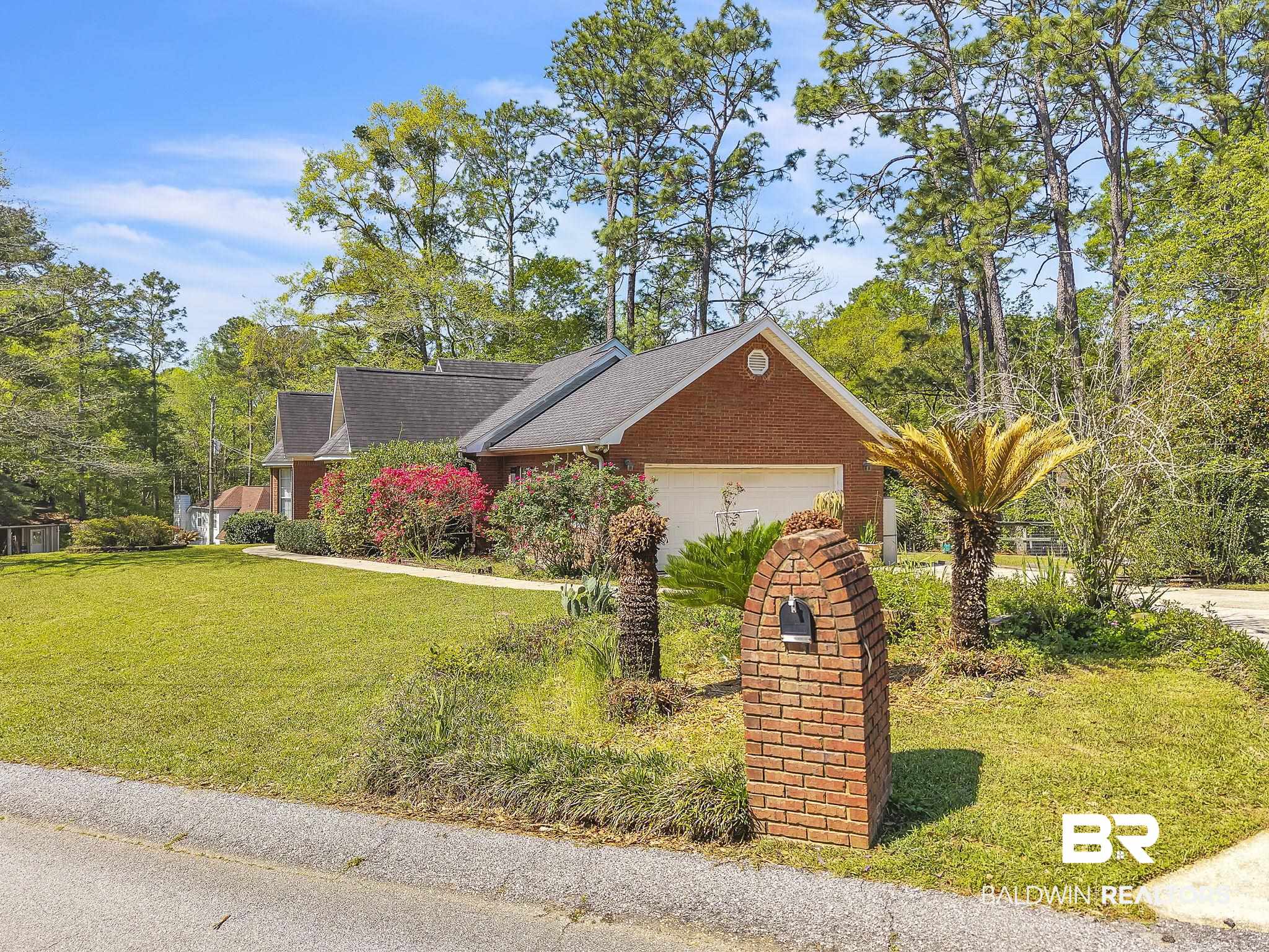 367 Ridgewood Drive Daphne, AL 36526 - Photo 7 of 71 Ranch-style house with brick siding, a garage, and a front lawn