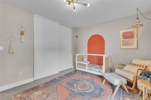 a living room with furniture and a rug