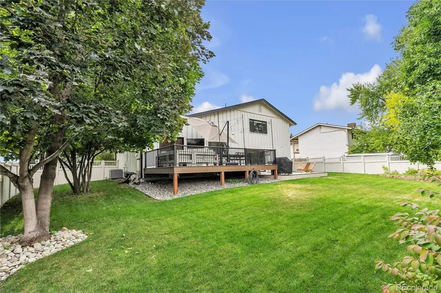 a view of a house with a yard porch and sitting area