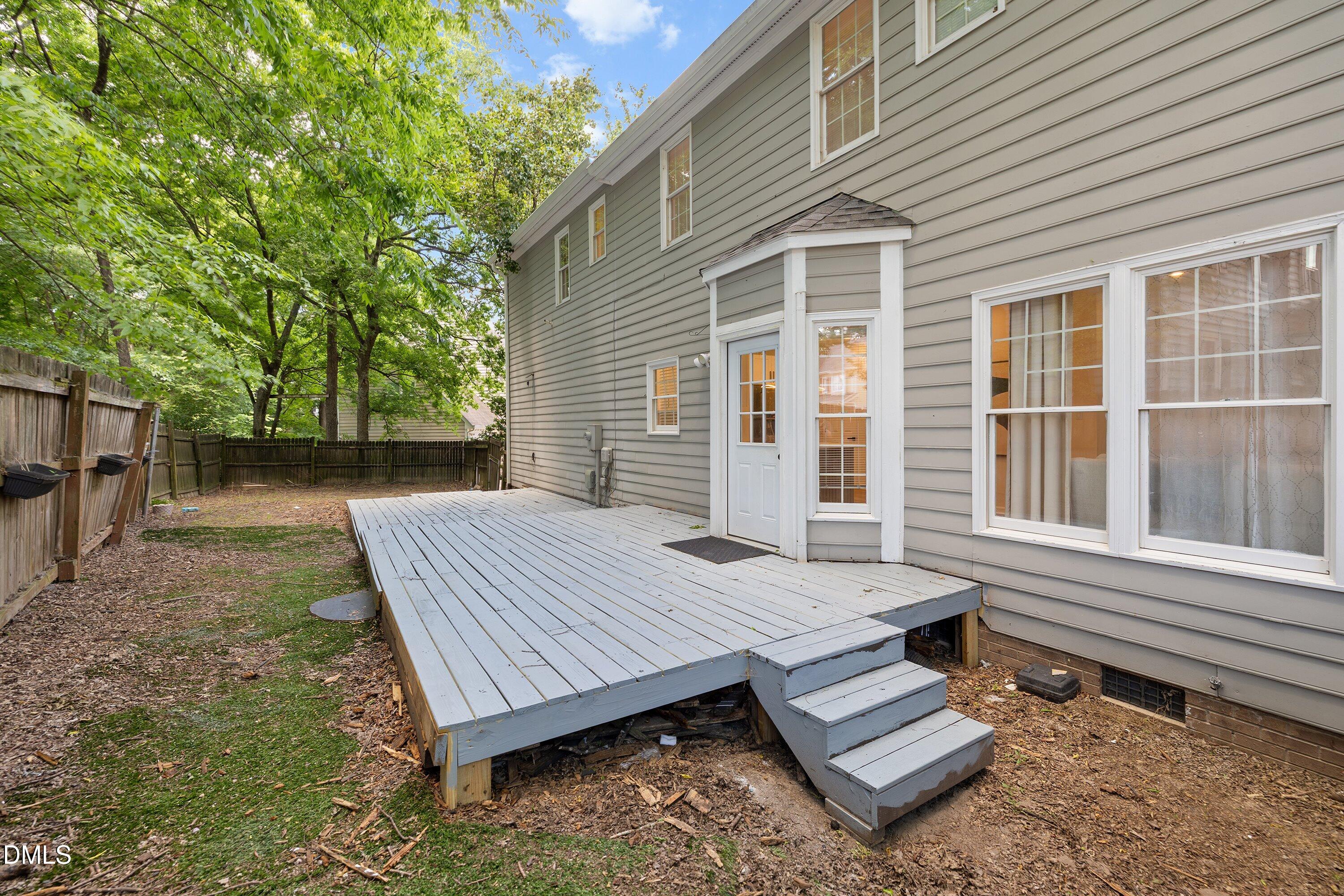 2517 Birchford Court Raleigh, NC 27604 - Photo 55 of 63 a view of a wooden floor with a bench in front of house