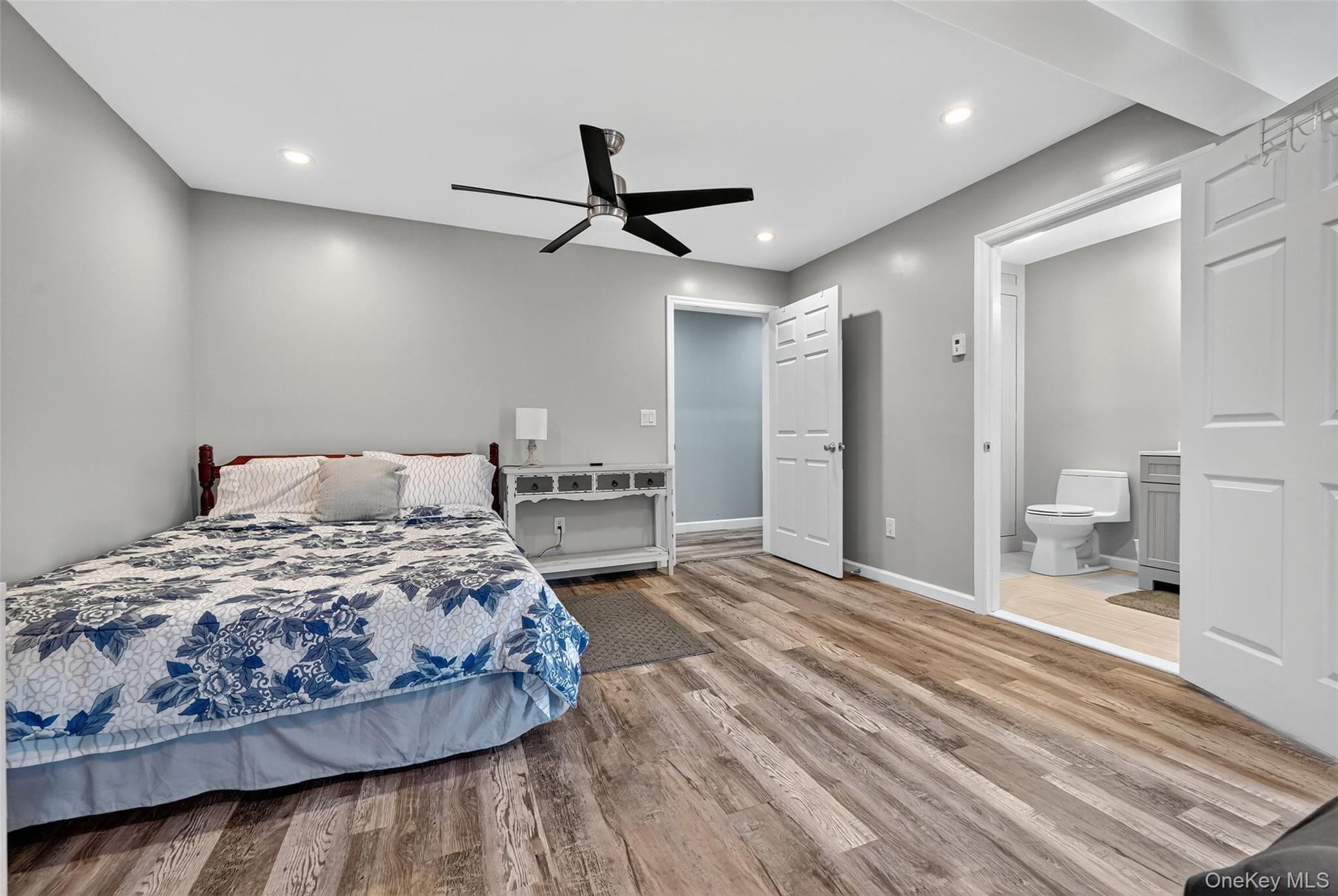 334 Greeves Road New Hampton, NY 10958 - Photo 11 of 45 a bedroom with a large bed and a chandelier