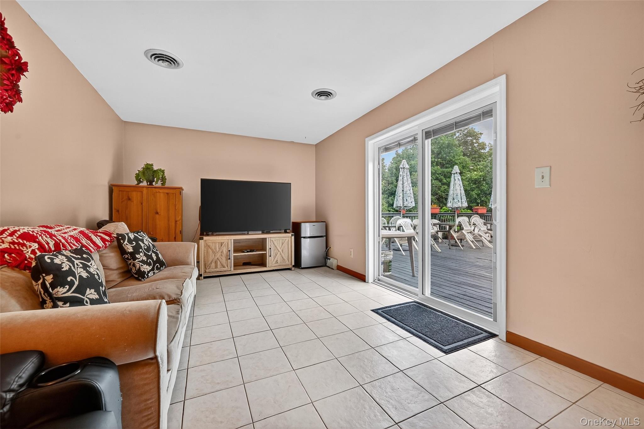 334 Greeves Road New Hampton, NY 10958 - Photo 14 of 45 a living room with furniture and a flat screen tv