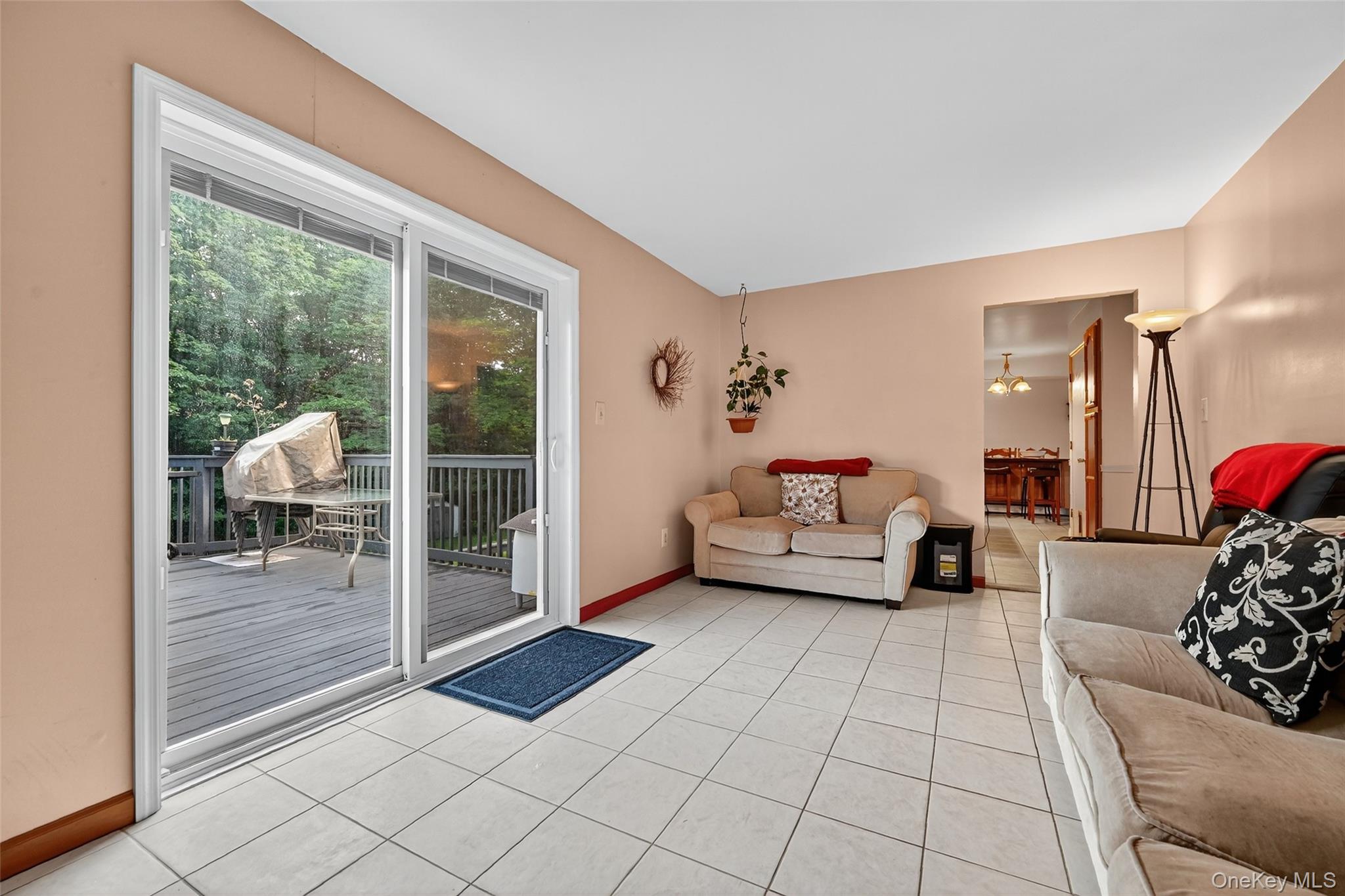 334 Greeves Road New Hampton, NY 10958 - Photo 16 of 45 a living room with furniture and a floor to ceiling window