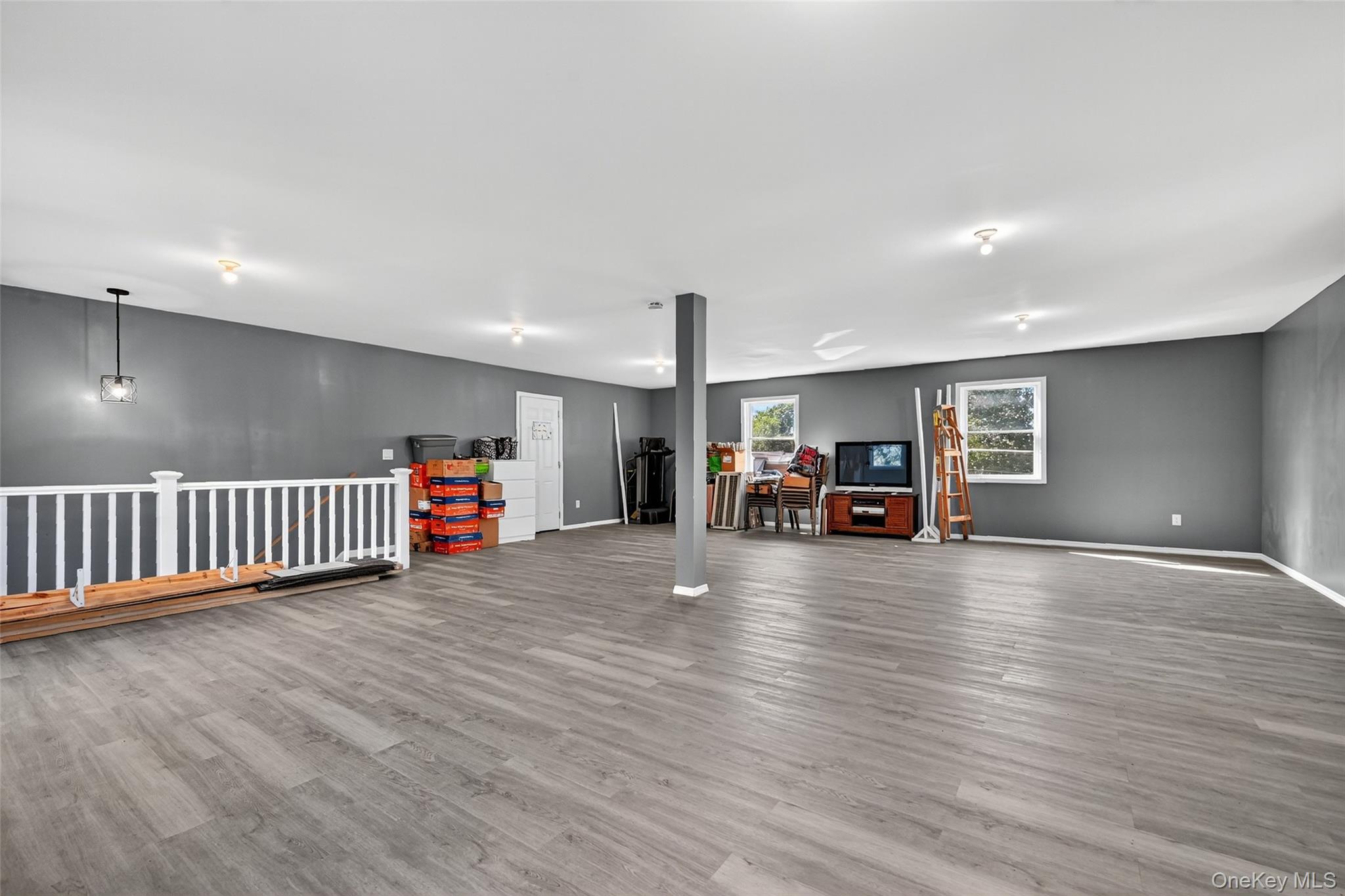 334 Greeves Road New Hampton, NY 10958 - Photo 28 of 45 a view of a livingroom with furniture hardwood floor and a ceiling fan