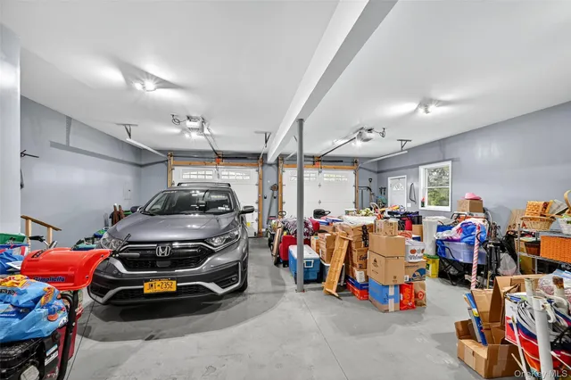 a view of a garage with a bike and car
