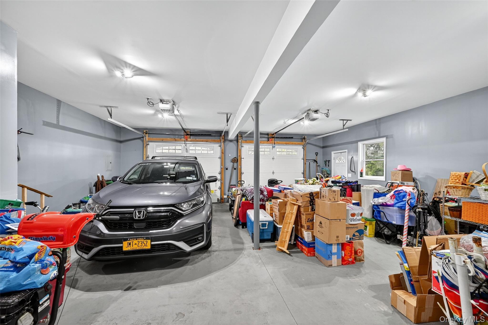 334 Greeves Road New Hampton, NY 10958 - Photo 34 of 45 a view of a garage with a bike and car